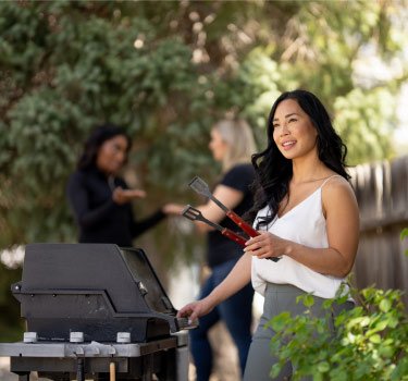 Woman at BBQ Grill