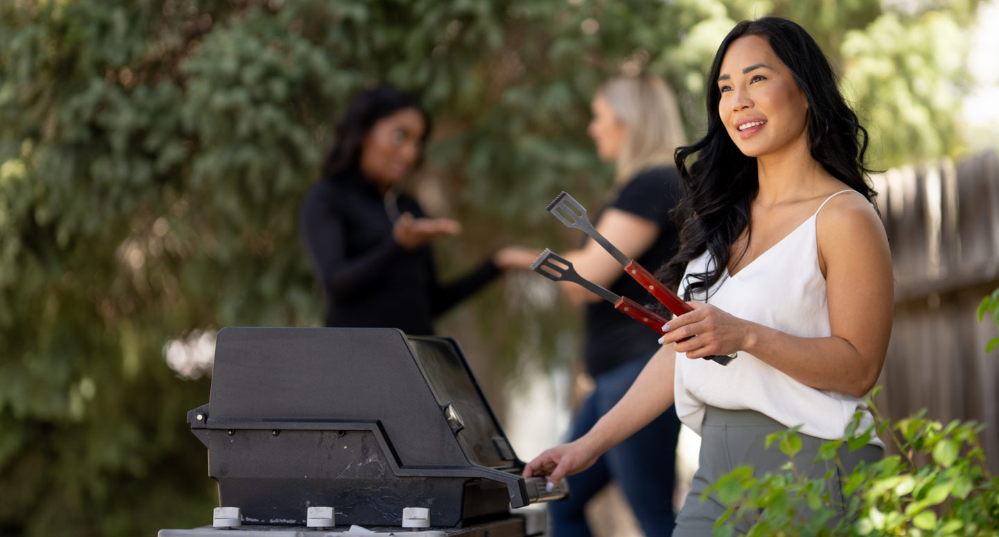 Woman at BBQ Grill