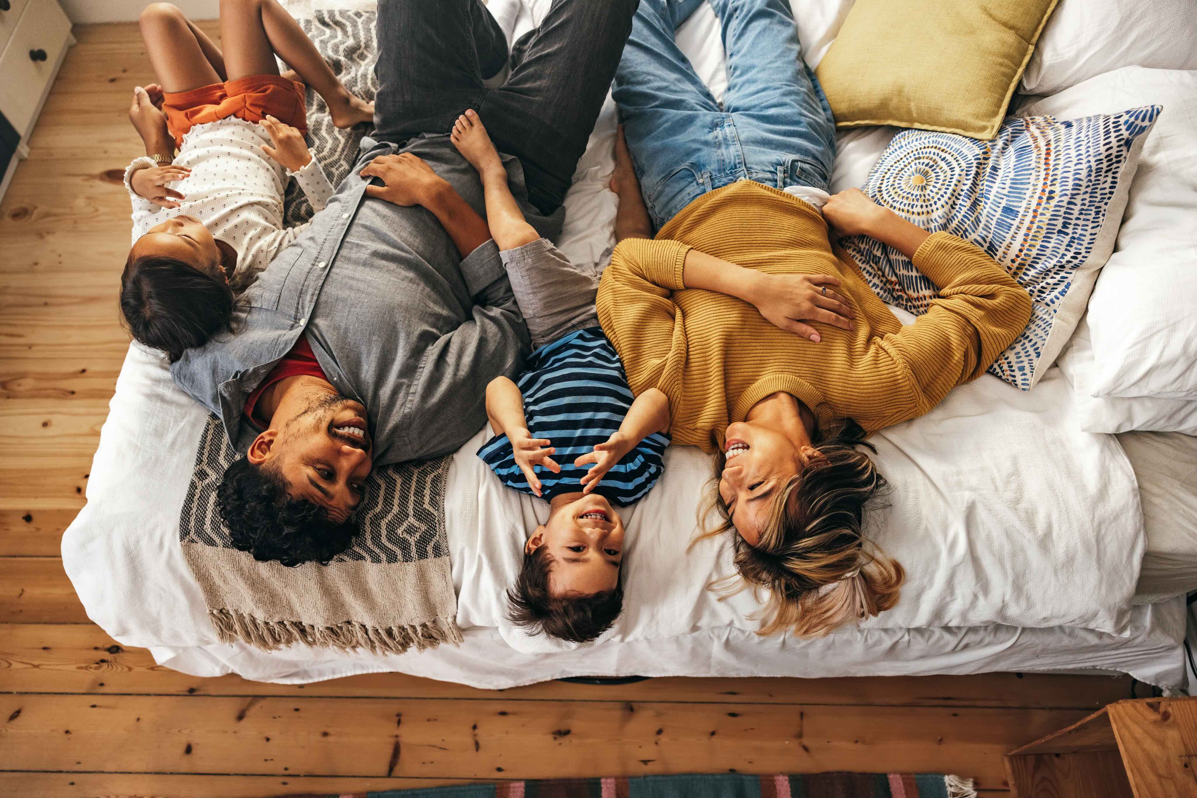 family on bed